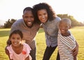 Portrait of smiling black family looking to camera outdoors Royalty Free Stock Photo