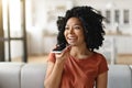 Portrait Of Smiling Black Female Recording Voice Message On Smartphone At Home Royalty Free Stock Photo