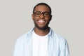 Portrait of smiling black man in glasses isolated in studio Royalty Free Stock Photo