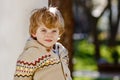 Portrait of smiling blond preschool boy, outdoors. Cute little child looking at the camera. Healthy happy kid. Royalty Free Stock Photo