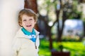 Portrait of smiling blond preschool boy, outdoors Royalty Free Stock Photo