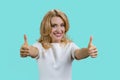 Portrait of a smiling blond woman gives both thumbs up. Royalty Free Stock Photo