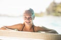 Portrait of smiling blonde in the pool Royalty Free Stock Photo