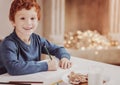 Portrait of smiling boy drawing a picture Royalty Free Stock Photo