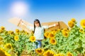 Cute boy aviator playing in sunflower field Royalty Free Stock Photo