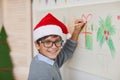 Smiling Boy Drawing on Walls on Christmas Royalty Free Stock Photo