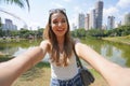 Portrait of smiling Brazilian girl takes selfie in Vaca Brava Park in Goiania, Goias, Brazil Royalty Free Stock Photo