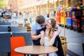 Portrait of smiling bride and groom sitting at cafe Royalty Free Stock Photo