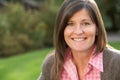 Portrait Of Smiling Brunette Woman Outdoors