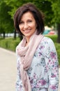 Portrait of smiling brunette woman in park Royalty Free Stock Photo