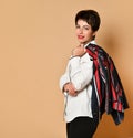 Portrait of smiling brunette woman with short haircut and red lipstick in stylish smart business clothing Royalty Free Stock Photo