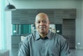 Portrait of smiling business black man person working from home and talking to his colleagues in webcam group video call