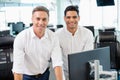 Portrait of smiling business colleagues working at desk Royalty Free Stock Photo