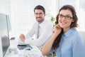 Portrait of smiling business coworkers sitting