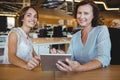 Portrait of smiling business executives holding digital tablet Royalty Free Stock Photo