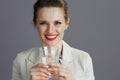 Portrait of smiling business owner woman in light business suit Royalty Free Stock Photo