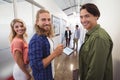 Portrait of smiling business people standing together in corridor Royalty Free Stock Photo