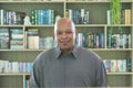 Portrait of smiling business senior old elderly black man, African American person working from home and talking to his colleagues Royalty Free Stock Photo