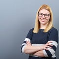 Portrait of a smiling business woman against gray background Royalty Free Stock Photo