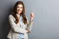 Portrait of smiling business woman pointing finger Royalty Free Stock Photo