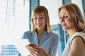 Portrait of smiling businesswomen looking at digital tablet in office Royalty Free Stock Photo