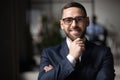 Portrait of smiling businessman posing at office Royalty Free Stock Photo