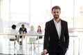 Portrait of smiling businessman posing for picture in office Royalty Free Stock Photo