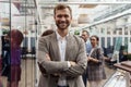 Portrait of smiling businessman standing in modern office on colleagues background Royalty Free Stock Photo