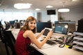 Portrait of smiling businesswoman holding digital tablet in office Royalty Free Stock Photo