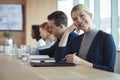 Portrait of smiling businesswoman sitting at office Royalty Free Stock Photo