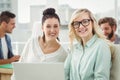 Portrait of smiling businesswomen working on laptop Royalty Free Stock Photo