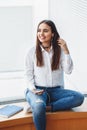 Portrait of smiling Caucasian brunette young beautiful girl woman model with long dark hair and brown eyes Royalty Free Stock Photo