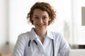 Portrait of smiling Caucasian female doctor in clinic Royalty Free Stock Photo