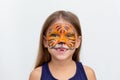 Portrait smiling child with tiger face painting Royalty Free Stock Photo