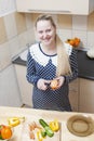 Portrait of Smiling Caucasian Pregnant Woman Making Salad with Vegetables on Kitchen Royalty Free Stock Photo