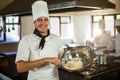 Portrait of smiling chef mixing dough Royalty Free Stock Photo