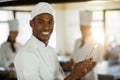 Portrait of smiling chef using digital tablet Royalty Free Stock Photo