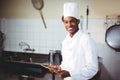 Portrait of smiling chef using digital tablet Royalty Free Stock Photo