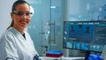 Portrait of a smiling chemist wearing safety glasses in lab looking at camera Royalty Free Stock Photo