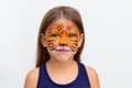 Portrait smiling child with tiger face painting Royalty Free Stock Photo