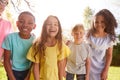 Portrait Of Smiling Children Outdoors At Home Looking Into Camera Royalty Free Stock Photo