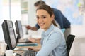 Portrait of smiling college girl working