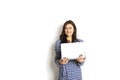 Portrait, smiling confident pretty woman long sleeve dress, holding grey laptop device and typing while standing against solid whi Royalty Free Stock Photo