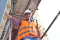 Portrait smiling construction manager / architect on site during the construction of a house - planning and control on site Royalty Free Stock Photo