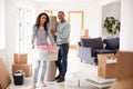 Portrait Of Smiling Couple Carrying Boxes Into New Home On Moving Day Royalty Free Stock Photo