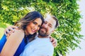 Portrait of smiling couple embracing in park Royalty Free Stock Photo