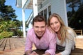 Portrait of smiling couple in front of their new home Royalty Free Stock Photo