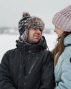 Portrait of smiling couple in love looking at each other. Young happy couple walking in winter Royalty Free Stock Photo