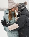 Portrait of smiling couple in love looking at each other. Young happy couple walking in winter Royalty Free Stock Photo