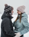 Portrait of smiling couple in love looking at each other. Young happy couple walking in winter Royalty Free Stock Photo